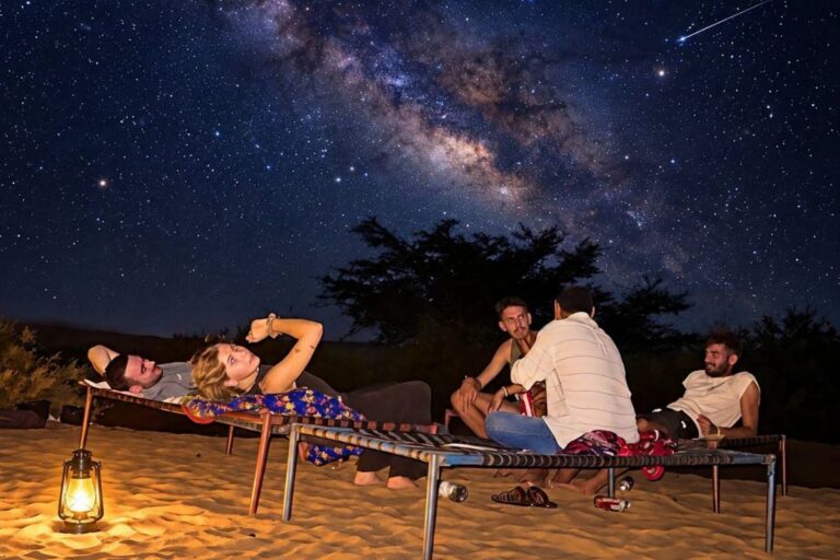 Tourists enjoying stargazing under the Milky Way in Jaisalmer desert