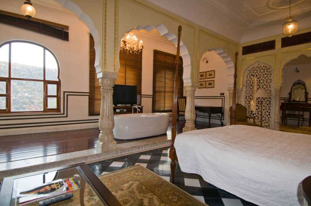 A luxurious Maharajah's suite at Samode Palace Hotel, offering opulent furnishings and decor.