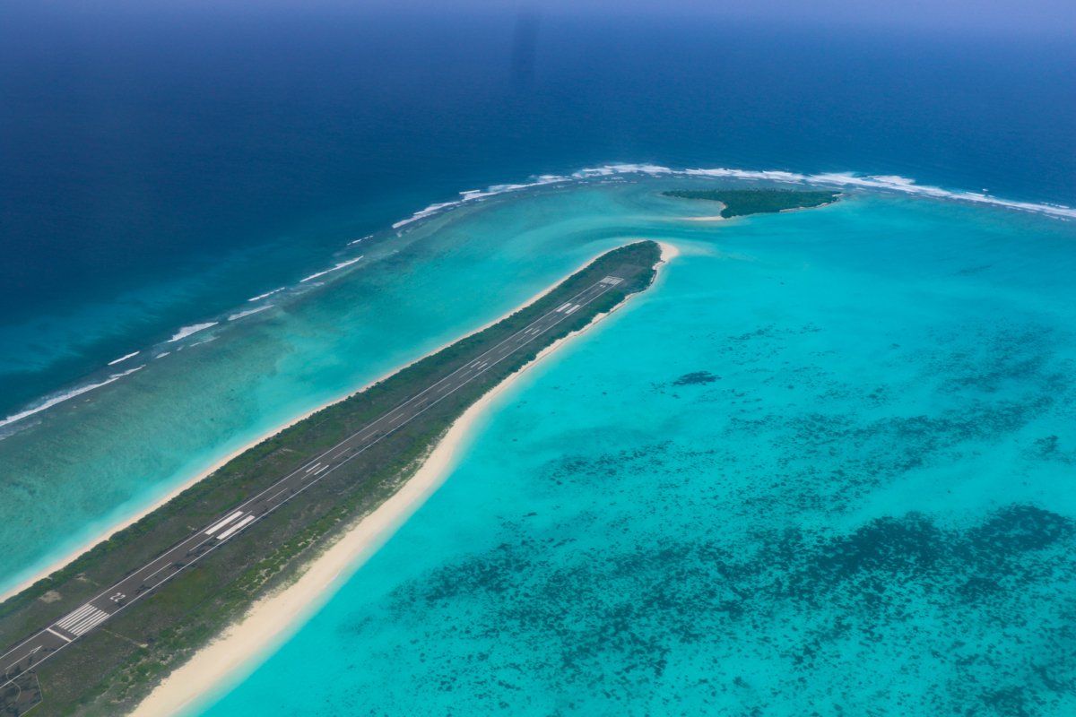 Touch down into tranquility at Agatti Airport (Lakshwadeep by Air) where the serene blend of ocean blues and verdant landscapes creates an enchanting welcome; Lakshadweep Travel Guide