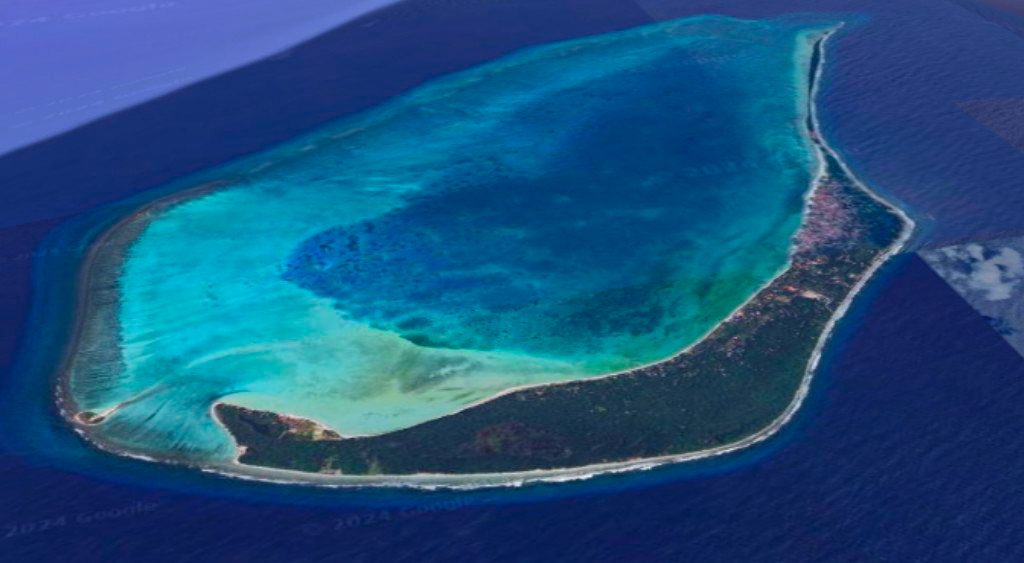 Lakshadweep Islands Guide: The Lakshadweep Archipelago showcases a unique formation of coral atolls and reefs. The accompanying image captures an aerial view of Minicoy Island, complemented by the Viringili Islet at its southern end, embraced by the breathtaking turquoise waters of the Minicoy Lagoon.