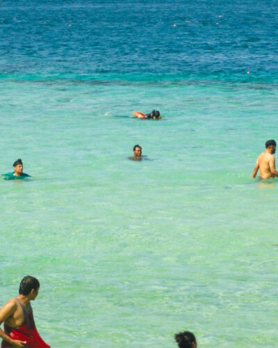 Jolly Buoy Beach with tiny waist high shallow turquoise lagoon attached to it. Andaman Tour Packages by SetMyTrip
