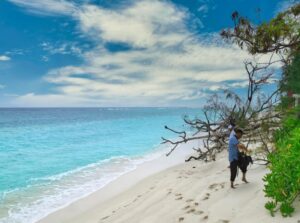 Immerse yourself in the tropical beauty of Kadmat Island's Eastern Lagoon Beach with SetMyTrip's '6 Nights 7 Days Agatti, Kavaratti & Kadmat Island Hopping Trip.' This serene beachscape features crystal-clear waters, pristine white sands, and lush greenery, offering a tranquil escape amidst Lakshadweep's enchanting island vibes.