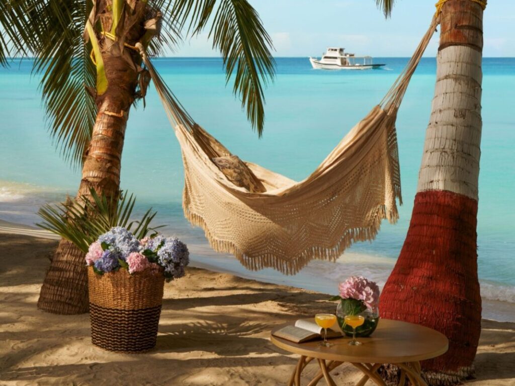 SetMyTrip’s 6 Nights 7 Days Lakshadweep Island Hopping Package for foreign nationals includes 3 nights at Kavaratti Beach Resort and 3 nights at IHCL Bangaram Island Resort or Bangaram IHCL Coral Pearl Resort, featuring idyllic beach escapes with hammocks, turquoise waters, and palm-shaded relaxation.