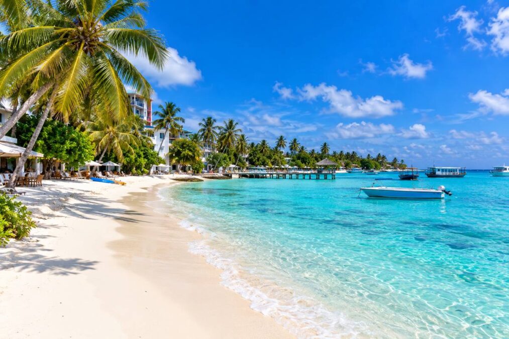 Maafushi Island Maldives beach with turquoise water and tropical palm trees