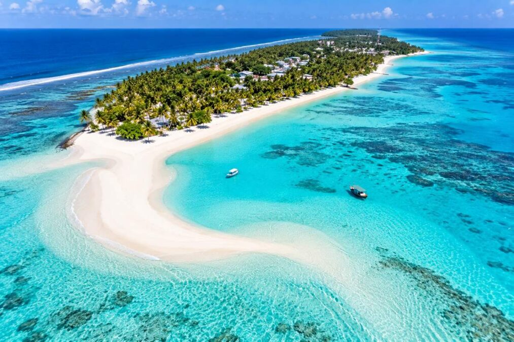 Aerial view of Ukulhas Island Maldives with white sandbank, turquoise lagoon and coral reef